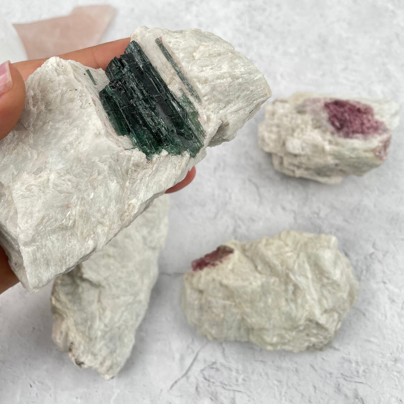 Watermelon Tourmaline freeform in hand for size reference 