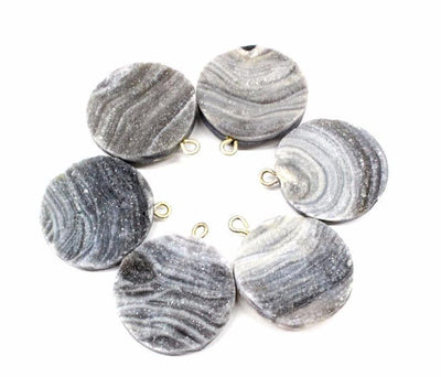 Gray Chalcedony Druzy Round Pendants with gold loop on top .