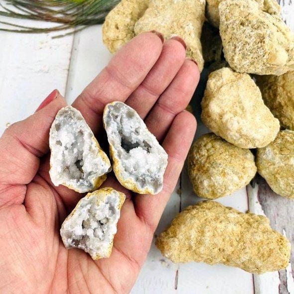 10 Break Your Own Geodes - White Color Geode on hand for size comparison opened up geodes in hand