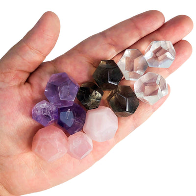 Geometric Shapes Gemstone Dodecahedron in different stones on hand for size comparison