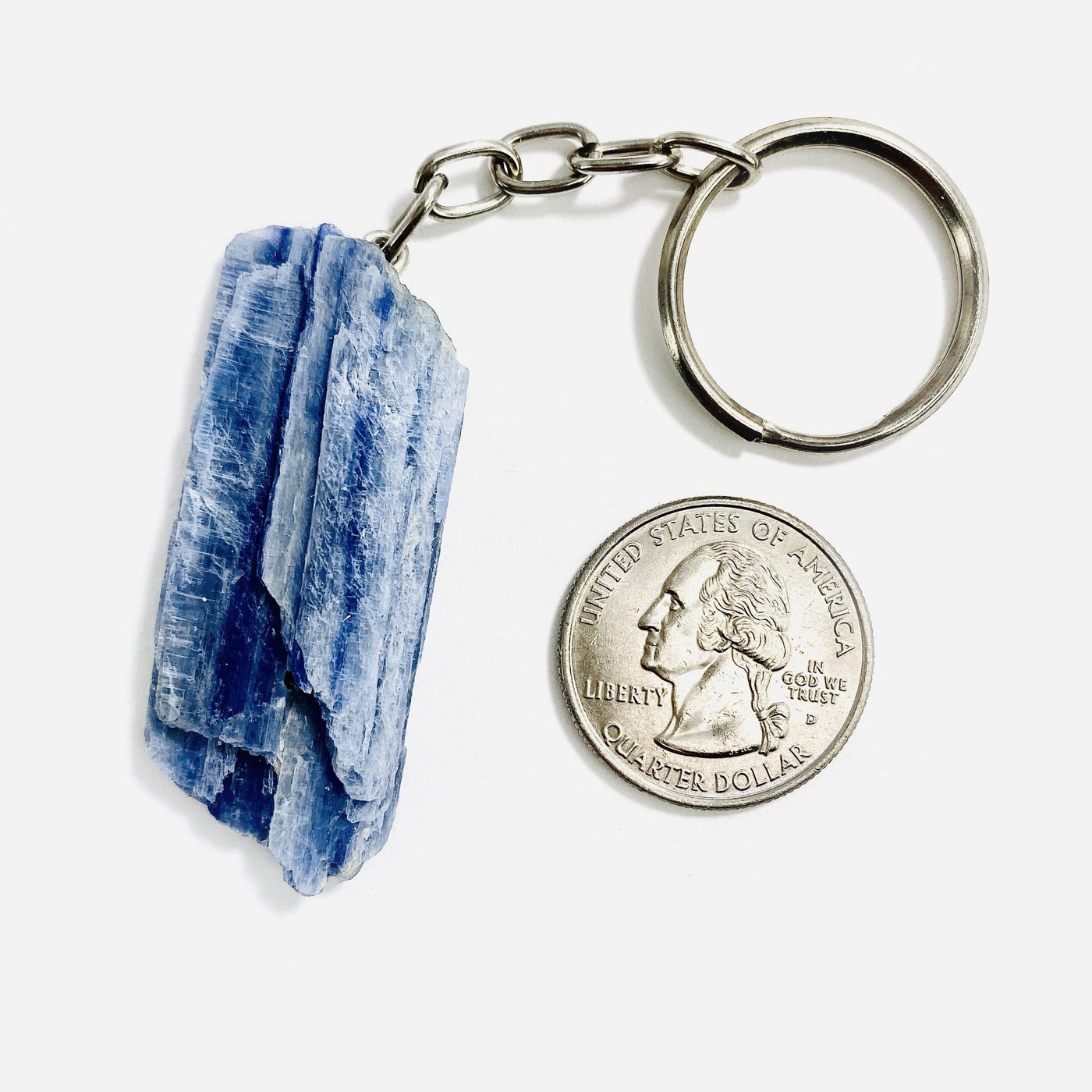 Blue Kyanite Silver Toned Key Chain displayed next to quarter for size reference