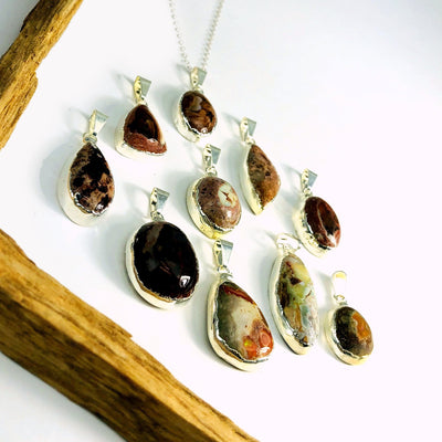 Mexican opal pendants in silver on white background