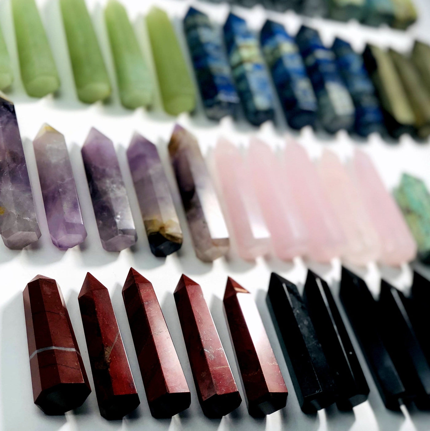Up close view of various Gemstone Pencil Polished Points