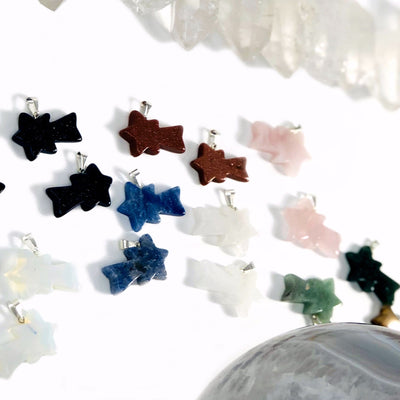 angled view of many shooting star pendants for thickness