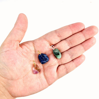 gemstones in hand for size reference