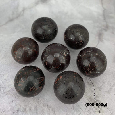 7 600-800g plum blossom jasper stone spheres on gray background