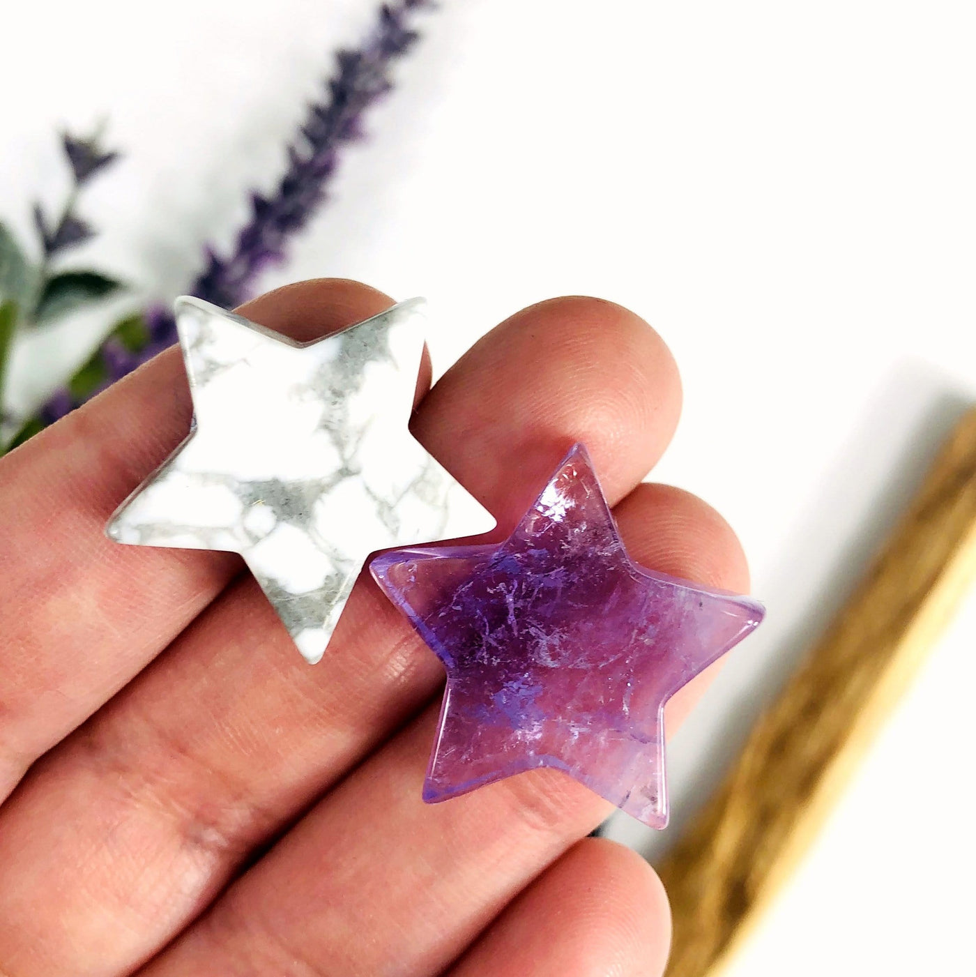 2 different Star Gemstone Cabochons displayed in hand
