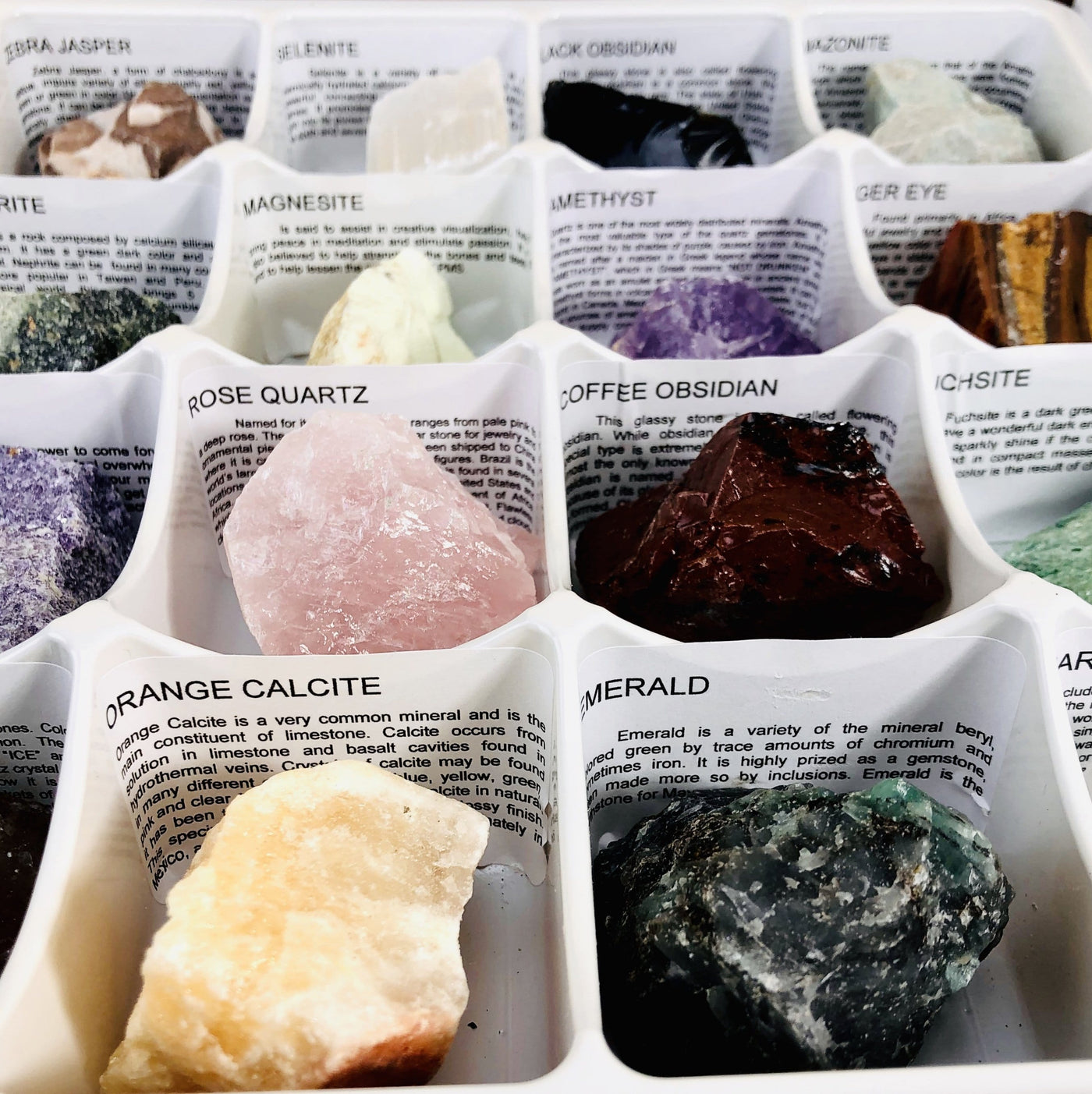 Up close shot of box of Rough Stones with meanings of each stone