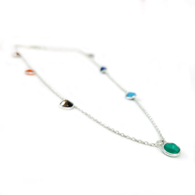 angled view of silver seven chakra dangle necklace