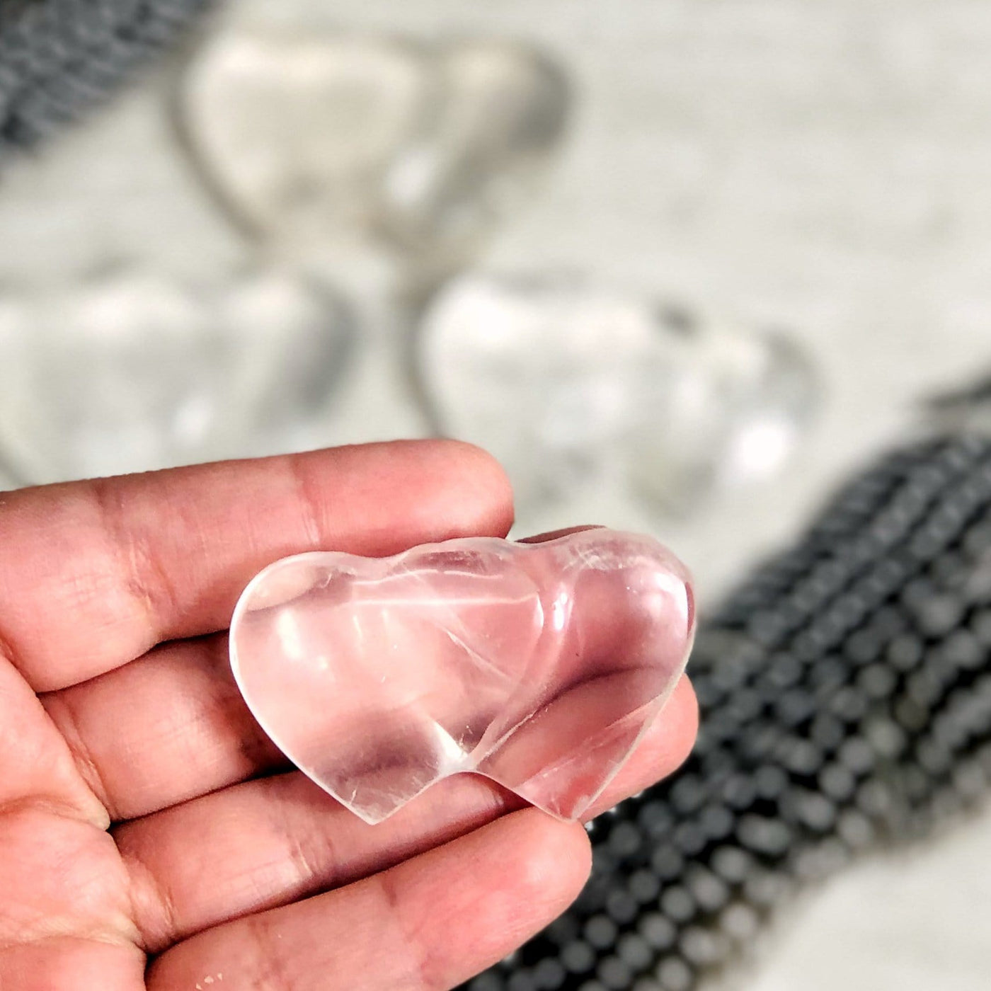 crystal double heart in a hand