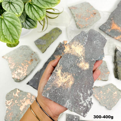 Copper Ore Slab  - 300-400g being held in a hand