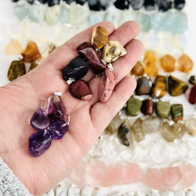 Tumbled Gemstone Extra Grade Pendants, various colors displayed in hand