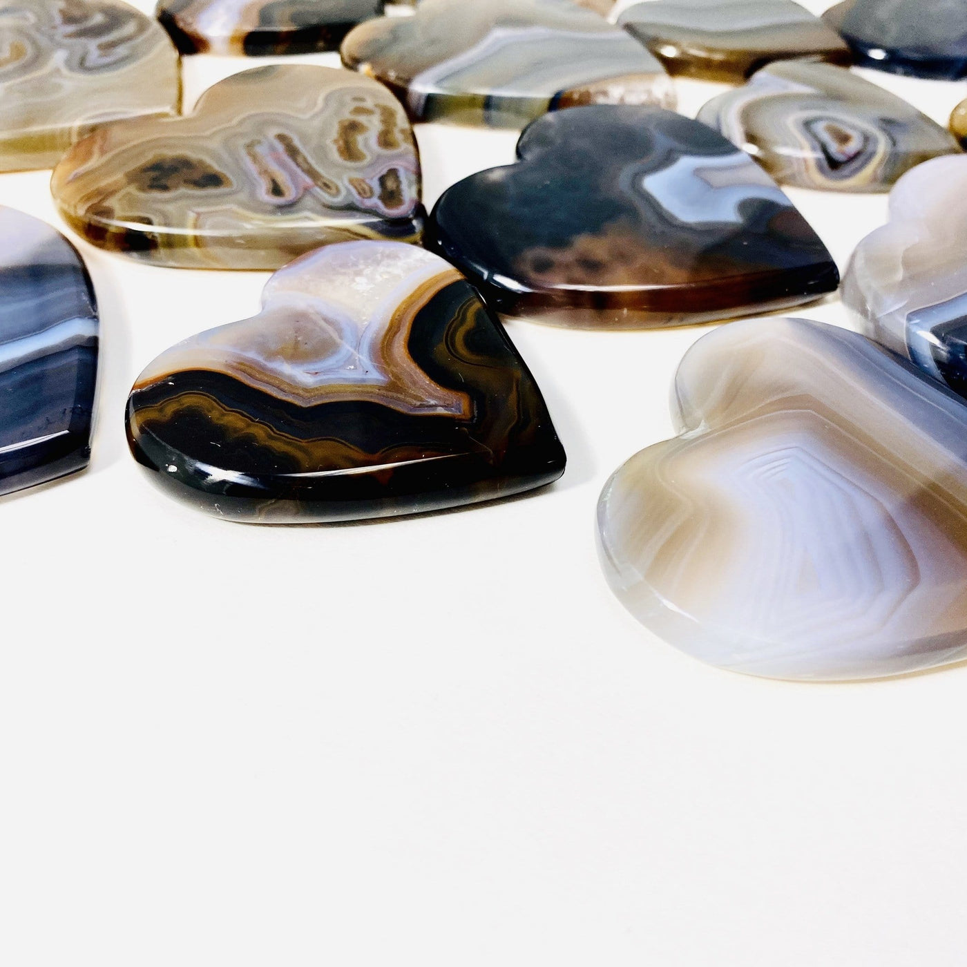 Natural Agate Heart Slices shown from the side to display thickness