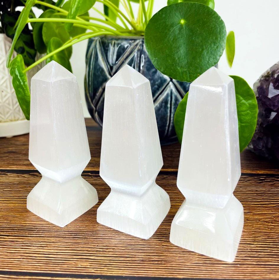 three selenite spear tips on display for details and possible variations