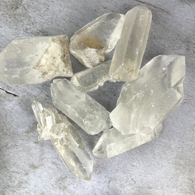 Crystal Quartz Points - 1 Pound Bag woth in a pile