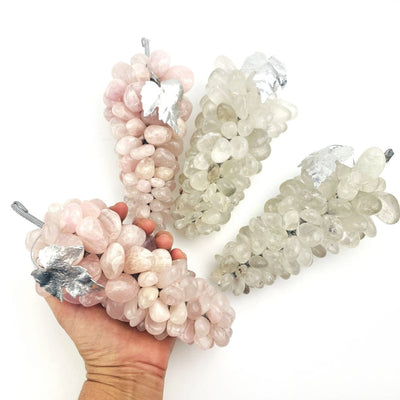 Large Polished Stone Grape Bunch with Silver Leaf, 2 with rose quartz and 2 with crystal quartz. One is held in a hand for size reference