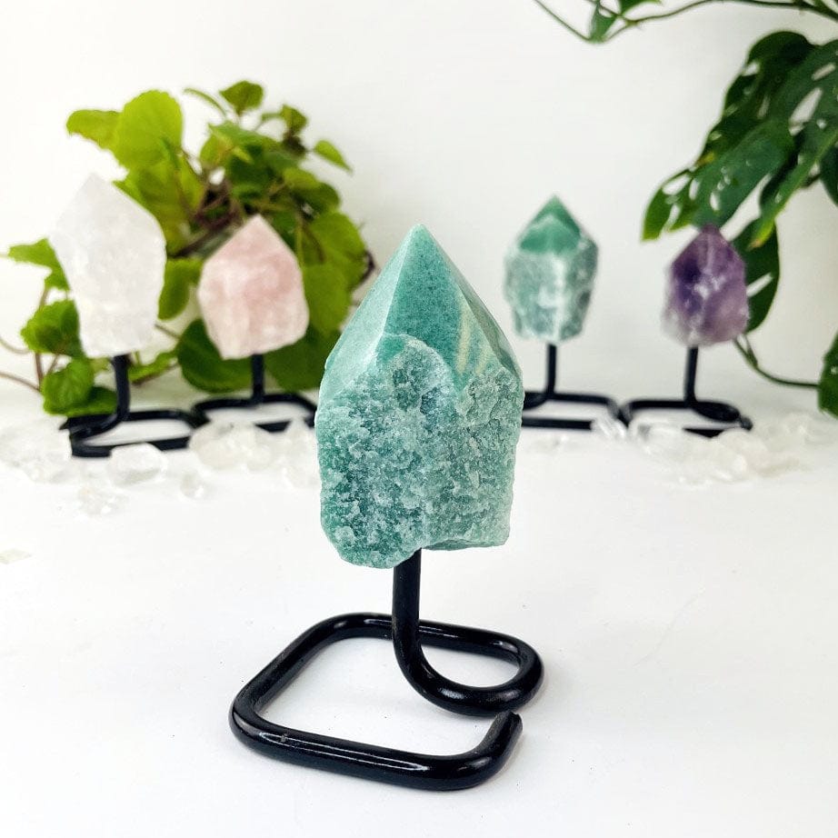 Semi Polished Points on Metal Stand with green quartz up close