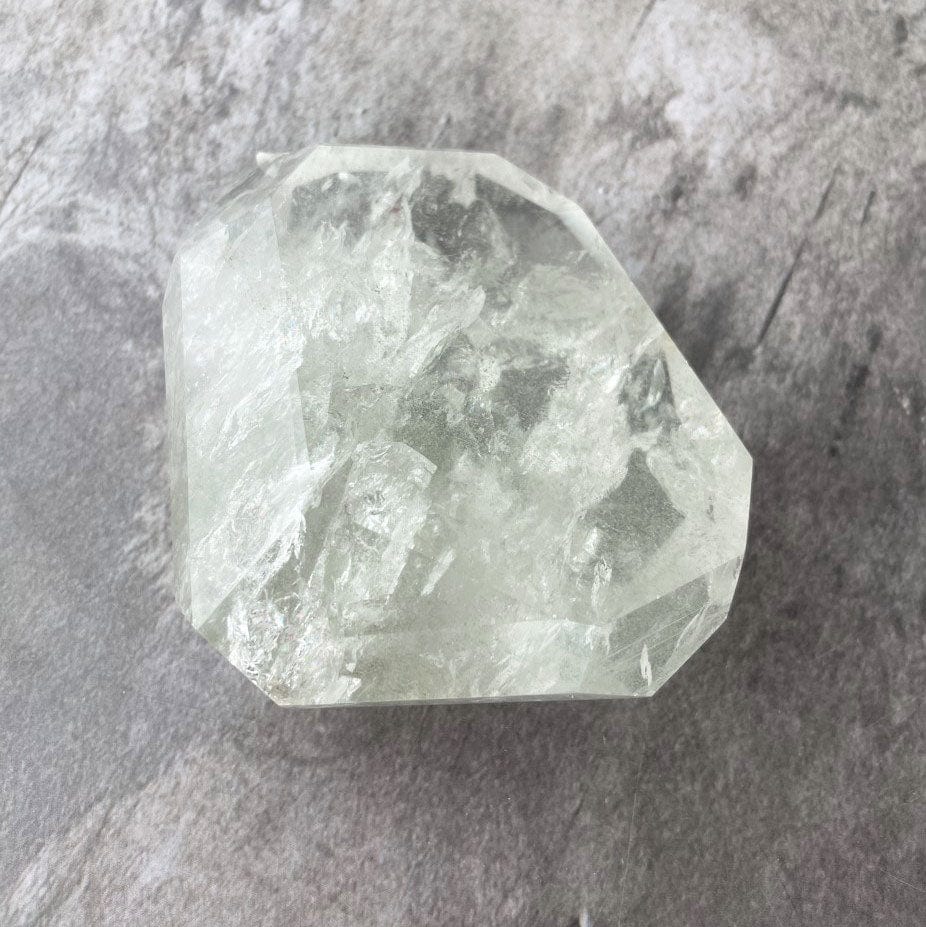 Crystal Quartz Polished Stone on a table