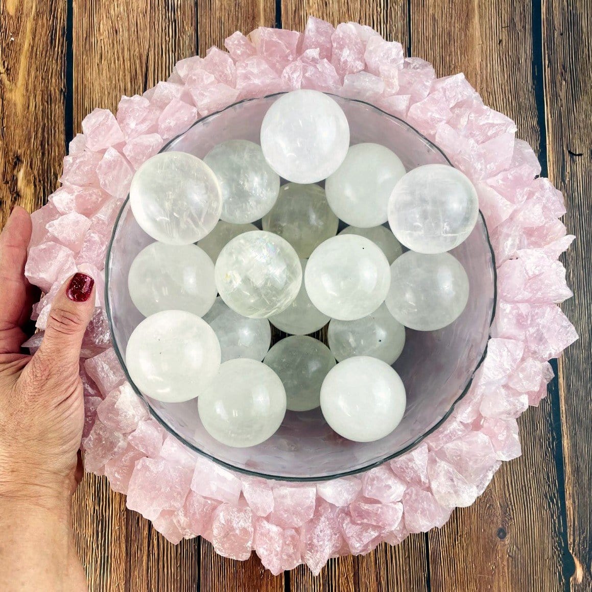 rose quartz bowl with spheres in it