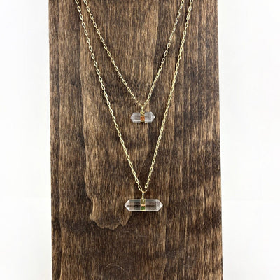 Crystal Point Necklace in gold on wood stand