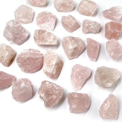 Rose Quartz Natural Stones layed out on a table