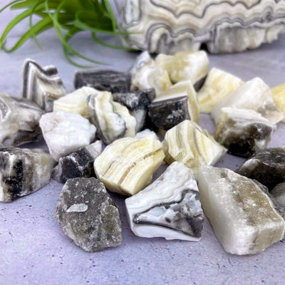 Mexican onyx stones displayed on a flat surface.