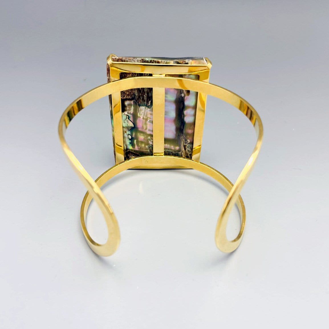 1 Abalone Geometric Cuff in  Gold Electroplate displaying the backside.