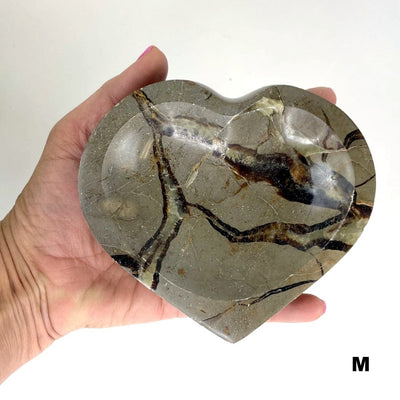 septarian heart bowl in a hand