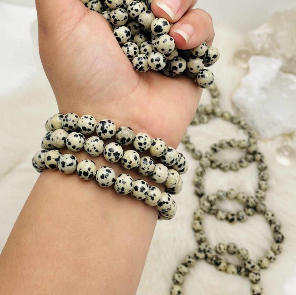 Dalmatian Jasper Bead Bracelets 8mm. Dalmatian Jasper is opaque, white spotted with brown and black like the dog! This stone helps you to move forward in life and discover your purpose, bringing joy and playfulness.