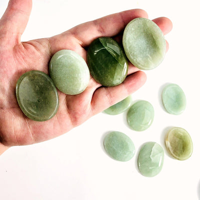 4 Green Aventurine Worry Stones in a hand