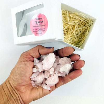 Rose Quartz Chubbie Box of Stones with the stones in a hand