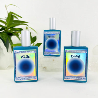 3 bottles of Gemstone Mist - Blue Vibrational Color with decorations in the background
