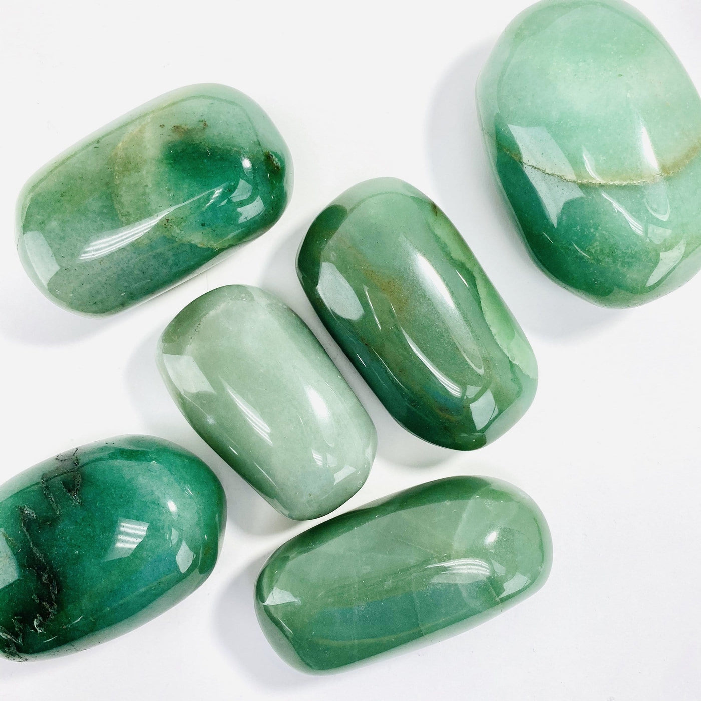 Green Aventurine Large Tumbled Stones scattered on a table