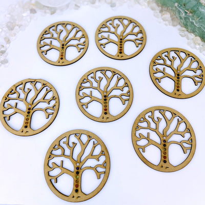 7 tree of life displays on white background