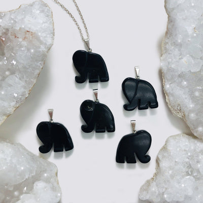 Elephant Gemstones Pendant Showing On Black Obsidian On a white background