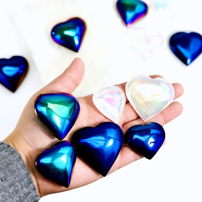 Titanium Hearts in hand for size reference
