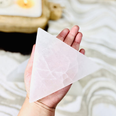 selenite triangle charging plate in hand for size reference