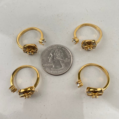 rings next to a quarter for size reference 