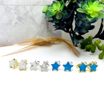 howlite star stud earrings with decorations in the background