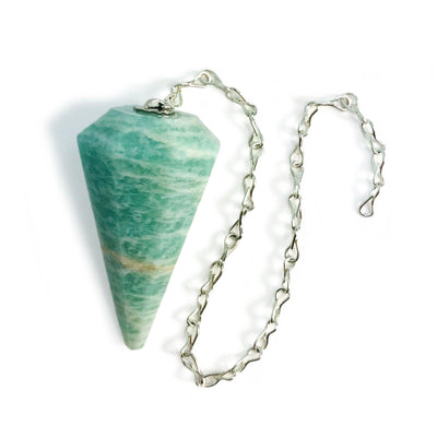One amazonite pendulum being displayed on a white surface.