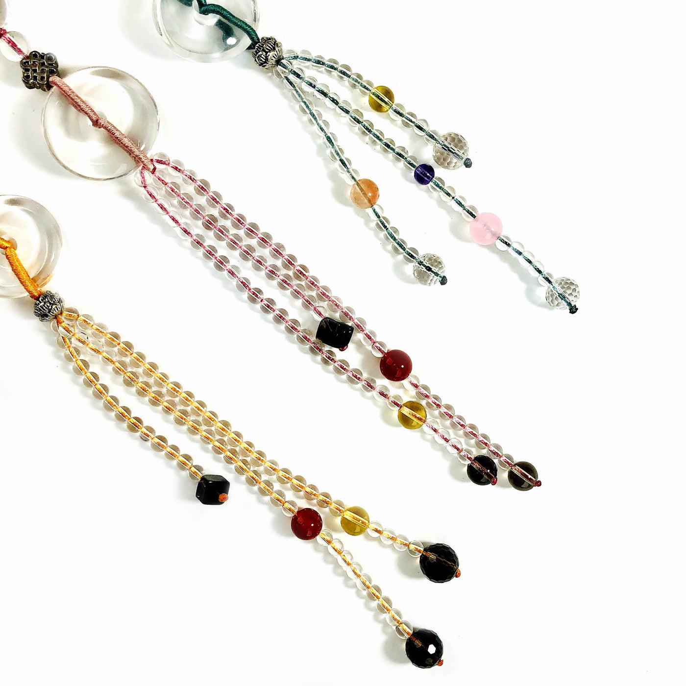 3 Colored Tassels with Assorted Stone Beads on white background