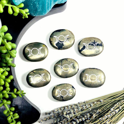 Multiple Pyrite Palm Stones Pocket Stones with Moon Phase in white background