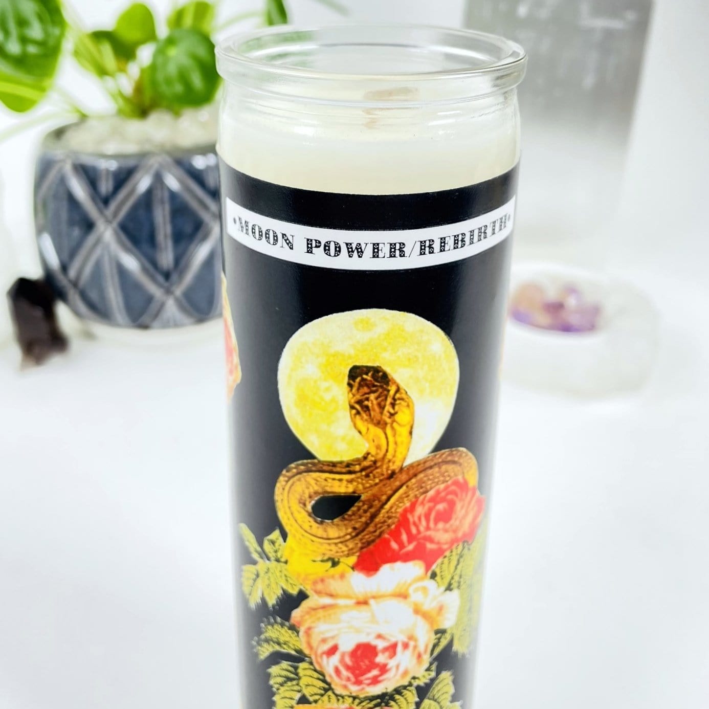 up close shot of Moon Power/Rebirth - Soy Candle with decorations in the background