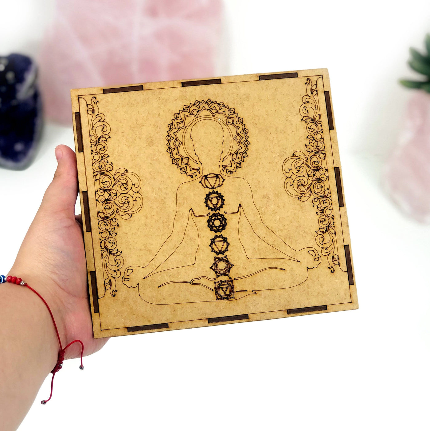 seven chakra box in hand for size reference and engraving details
