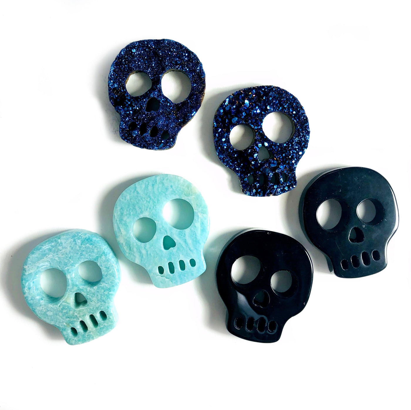Gemstone Skull Cabochons  - on a table