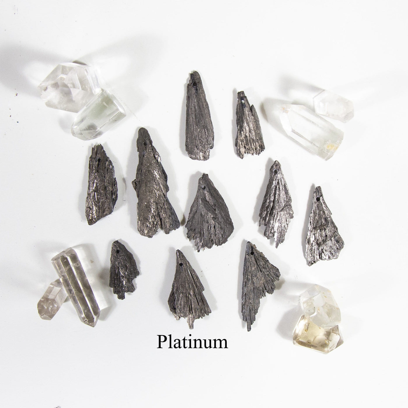 platinum titanium treated kyanite blades on white background