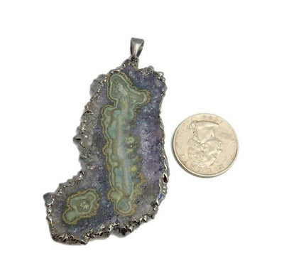 Extra Large Amethyst Stalactite Pendant with Electroplated Gun Metal Edge next to a quarter on white background.