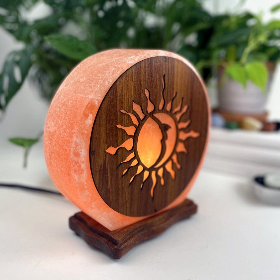 Himalayan salt lamp with sun moon design upside down sold as is from side view