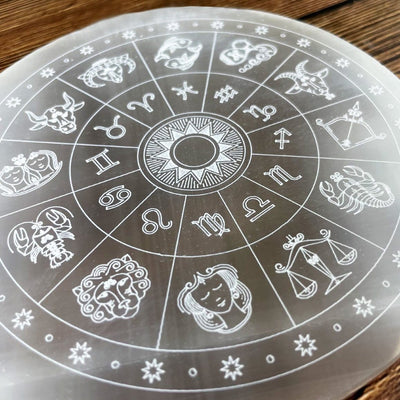close up of selenite zodiac engraved charging plate for engraving details
