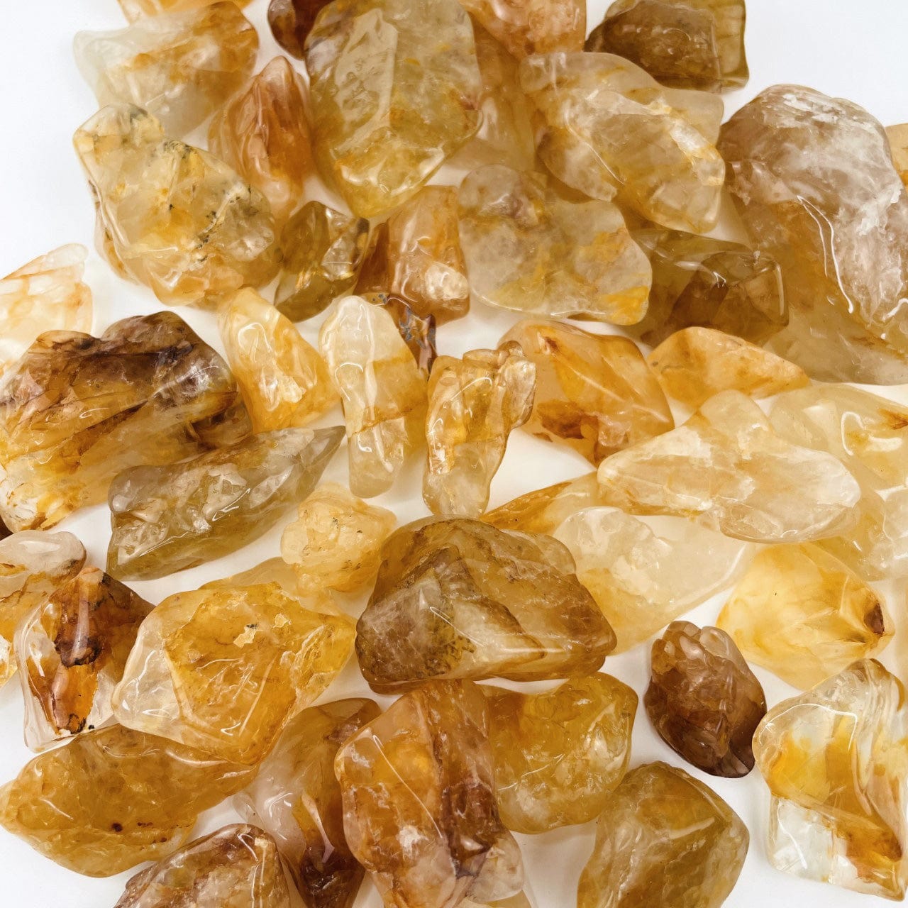 Golden Healer Quartz Polished Tumbled Stones in a pile